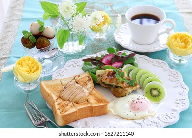 Plate Of Peanut Butter Toast,fried Egg,stuffed Zucchini, And Turnip Kiwi Carpaccio