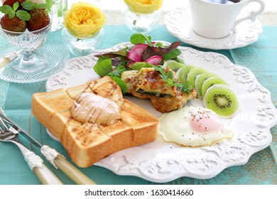 Plate Of Peanut Butter Toast,fried Egg,stuffed Zucchini, And Turnip Kiwi Carpaccio