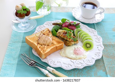 Plate Of Peanut Butter Toast,fried Egg,stuffed Zucchini, And Turnip Kiwi Carpaccio