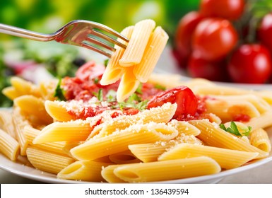 plate of penne pasta with tomato sauce - Powered by Shutterstock