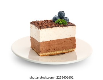 Plate with piece of birds milk cake, blueberries and mint leaves on white background - Powered by Shutterstock