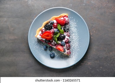 Plate With Piece Of Delicious Berry Pie On Table