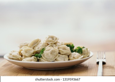 Plate Of Ravioli With Greens