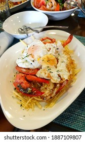 A Plate At A Restaurant In Ibiza: Fried Fries, Lobster And Eggs