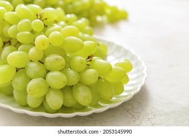 Plate With Ripe Green Grapes On Table, Closeup