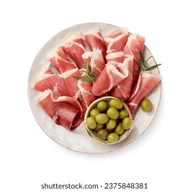 Plate with rolled slices of delicious jamon, olives and rosemary isolated on white, top view