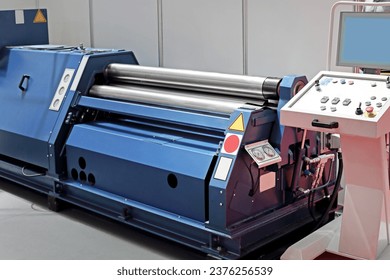 Plate Rolling Machine Press Rollers in Steel Factory Production - Powered by Shutterstock