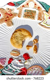 A Plate For Santa's Cookies, And He Left Only One Half-eaten Cookie Left, And Some Crumbs (close-up).