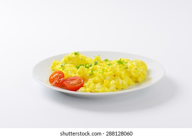 Plate Of Scrambled Eggs On White Background