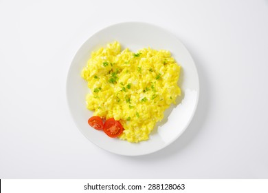 Plate Of Scrambled Eggs On White Background