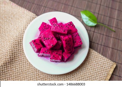 A Plate Of Seductive Red Dragon Fruit Placed On A Tablecloth Top View