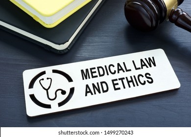 Plate With Sign Medical Law And Ethics.