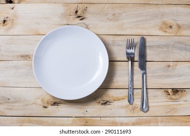 plate and silverware over white wooden background, View from above,on top - Shutterstock ID 290111693
