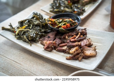 A Plate Of Slice Brisket With Chili Paste 