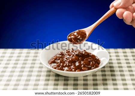 A plate of soybean paste is placed on the table in close up