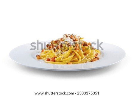 Plate of spaghetti carbonara with black pepper and pecorino cheese on white background