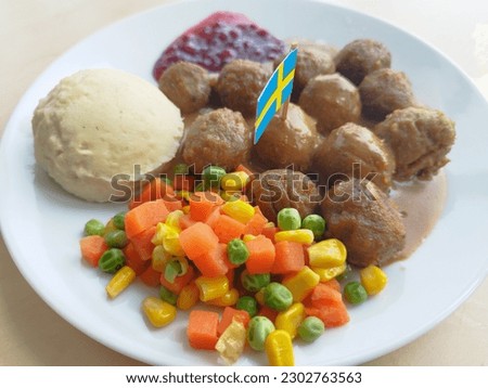 A plate of swedish meatballs in an ikea restaurant at kota Baru Parahyangan, West Bandung, Indonesia placed on a light brown table.