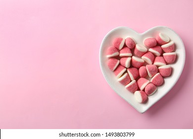 Plate of sweet jelly candies on pink background, top view. Space for text - Powered by Shutterstock
