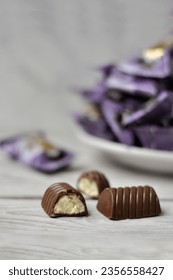 a plate of sweets. purple background. blurred background - Shutterstock ID 2356558427
