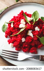 Plate with tasty beet risotto, closeup