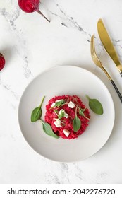 Plate with tasty beet risotto on light background