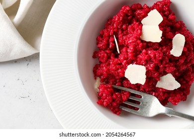 Plate with tasty beet risotto on light background, closeup