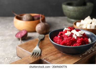 Plate with tasty beet risotto on grey background