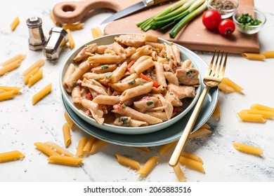 Plate With Tasty Cajun Chicken Pasta On Light Background