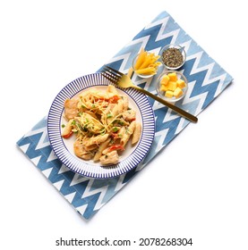 Plate With Tasty Cajun Chicken Pasta On White Background