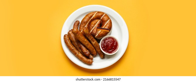 Plate With Tasty Sausages, Sauce And Flag Of Germany On Orange Background, Top View