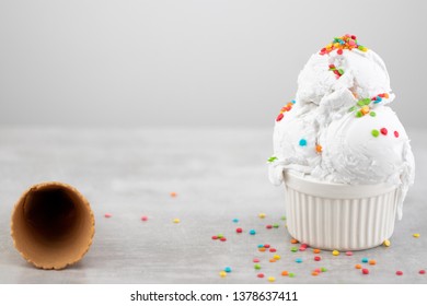 Plate Of Vanilla Ice Cream Scoop Swith Sprinkles And Waffle Cones  With Copy Space.