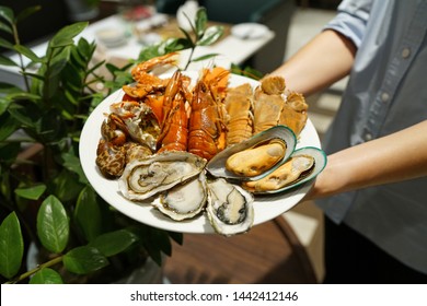 Plate Of Various Types Of Seafood Set, Steamed Rock Lobster, Baby Lobster, New Zealand Mussel, Blue Crab And Fresh Pacific Oyster, Dinner Buffet Seafood Night.