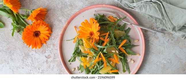 Plate With Vegetarian Low Calorie Salad With Arugula, Oranges And Edible Calendula Flowers On A Light Table