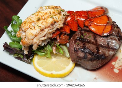 Plated Steak And Lobster Dinner.