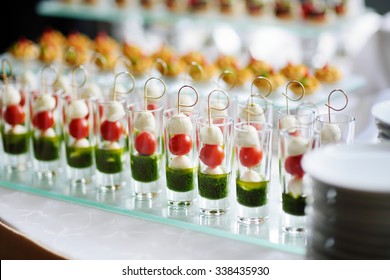 Plates With Assorted Finger Food Snacks On An Event Party Or Dinner