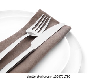 Plates With Clean Cutlery And Napkin Isolated On White