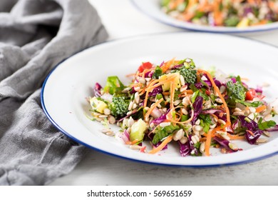 Plates with Colorful Mixed Vegetables and Greens Salad