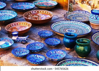 Plates and pots on a street market in the city of Bukhara, Uzbekistan