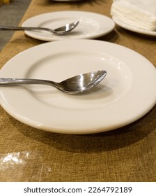 plates with spoon on table