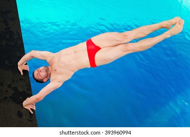 Platform Diving Competitor, Taking Off From Handstand, Shot From Above