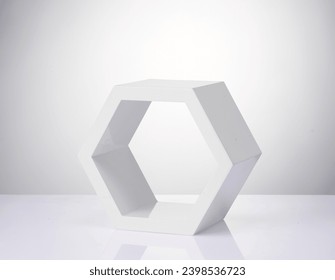 a platform of a hexagonal model against a white background. An empty platform for display products, food and design
