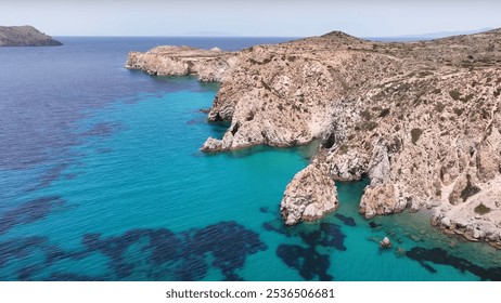 Plathiena, Greece. Drone view of a rocky cliff with a body of water situated below it. It captures the natural beauty of coastal landforms and outdoor landscapes. - Powered by Shutterstock