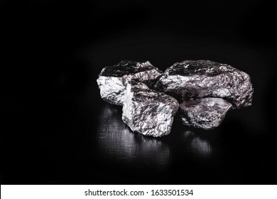 Platinum is a chemical element used in the chemical industry as a catalyst for the production of nitric acid, silicone and benzene. Crude platinum stone, industrial use. - Shutterstock ID 1633501534