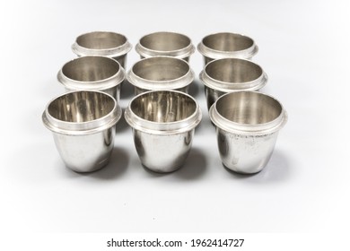 Platinum crucibles used for sample preparation in an analytical chemistry laboratory. Shiny metal lab equipment