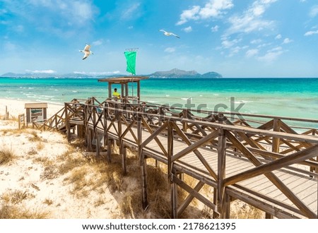 Platja de Muro, Majorka. Wooden platform and lifeguard tower on the sandy sea beach Zdjęcia stock © 