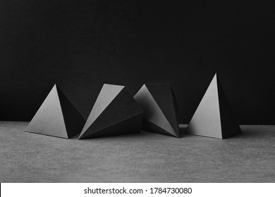 Platonic solids figures geometry. Abstract geometrical figures still life composition. Three-dimensional prism pyramid objects on black gray background - Shutterstock ID 1784730080