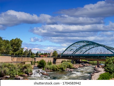 The Platte River Running Under A Bridge In Confluence Park In Denver, Colorado