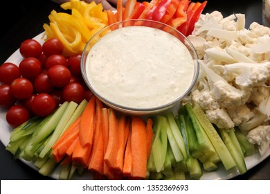 Platter Of Assorted Fresh Vegetables With Dip Sauce On Center