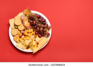 Platter with crunchy crackers and cheese on color background - Powered by Shutterstock