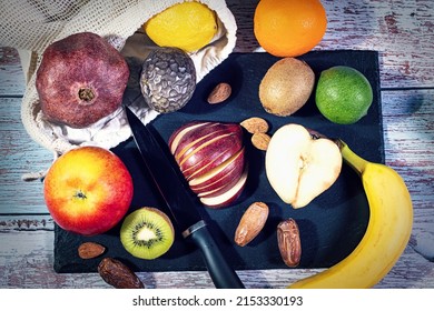 A platter of different types of fruit to prepare a fruit salad. 
